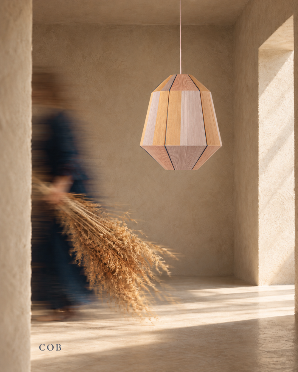 COB sculptural pendant lamp from the HOMMETRY ISLANDS collection in a warm architectural interior