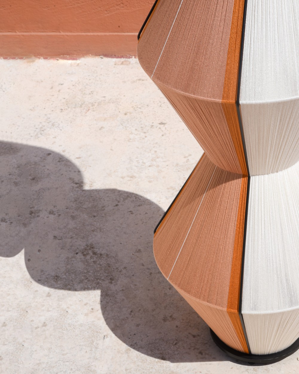 STELE floor lamp detail with sculptural shadow by HOMMETRY