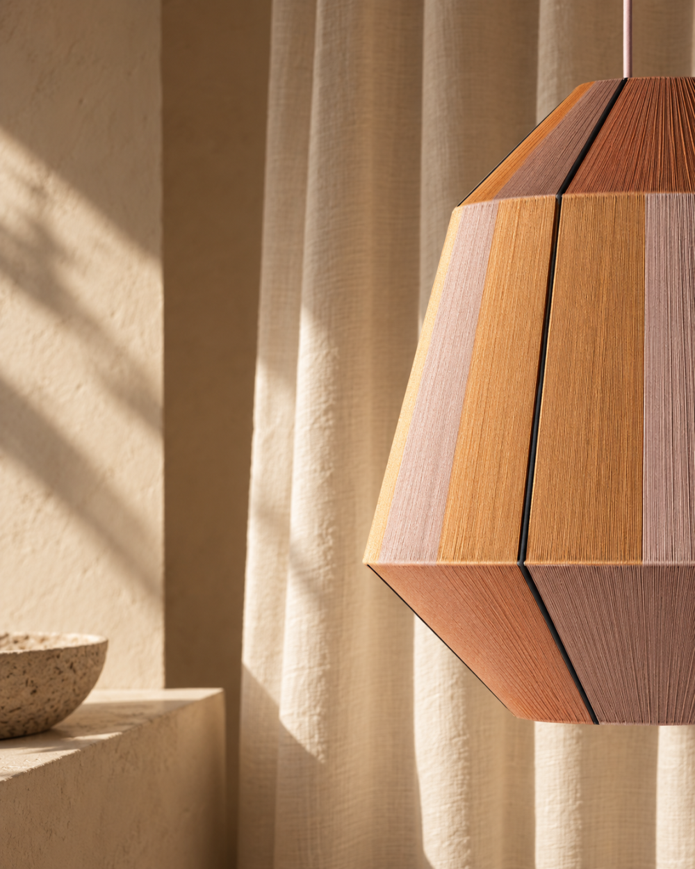 COB pendant lamp by HOMMETRY suspended in a minimal plaster interior with natural light